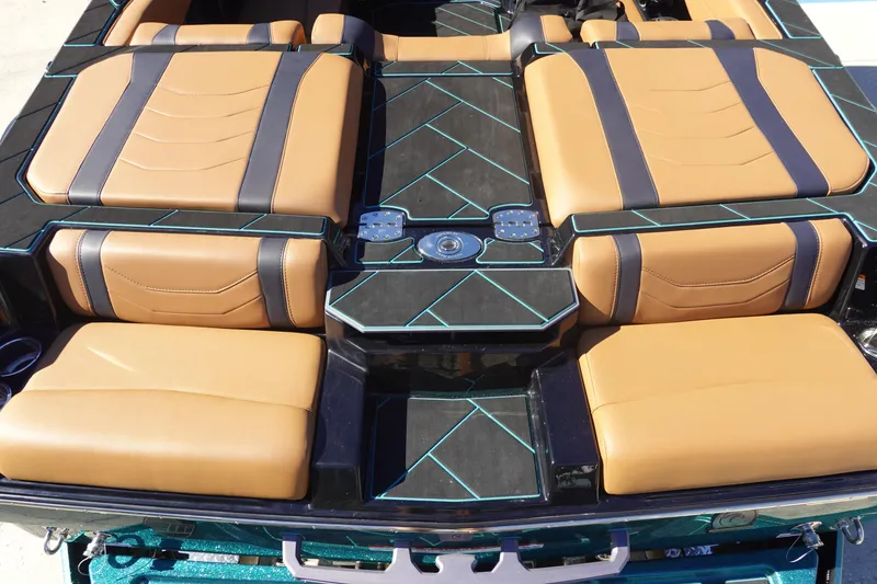 Slide: The Image of 2026 Malibu Wakesetter 23 LSV interior with tan and black seating, blue accents. - 8