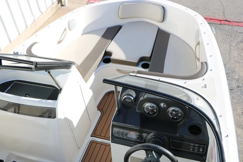 Slide: The Image of 2009 Bayliner VR4 Bowrider I/O interior with dashboard and seating area. - 18