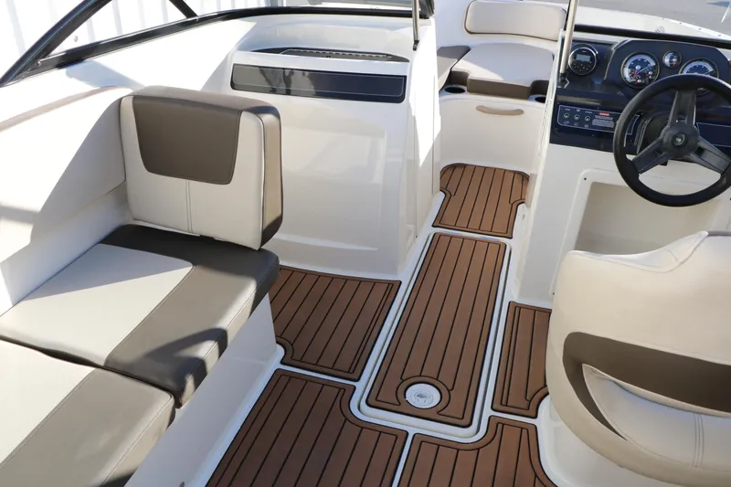Slide: The Image of Interior of 2009 Bayliner VR4 Bowrider I/O with stylish seating and wood-patterned flooring. - 20