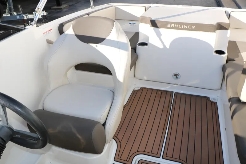 Slide: The Image of 2009 Bayliner VR4 Bowrider I/O interior with seating and wood-patterned flooring. - 22