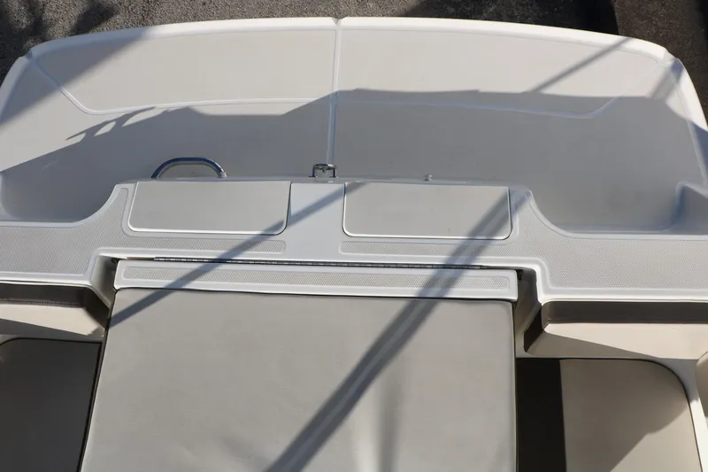 Slide: The Image of 2009 Bayliner VR4 Bowrider I/O boat interior, featuring sleek seating and storage compartments. - 31