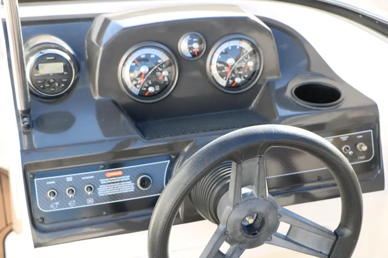 Slide: The Image of Dashboard of 2009 Bayliner VR4 Bowrider I/O with steering wheel and gauges. - 32