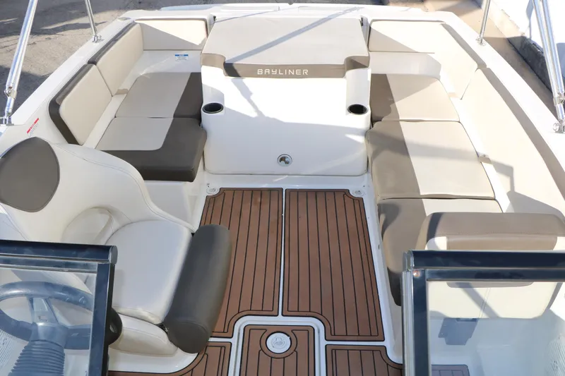 Slide: The Image of 2009 Bayliner VR4 Bowrider I/O interior with cushioned seating and wood-patterned flooring. - 34