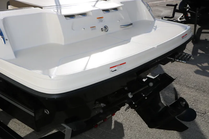 Slide: The Image of 2009 Bayliner VR4 Bowrider I/O boat stern with outboard motor and swim platform. - 9