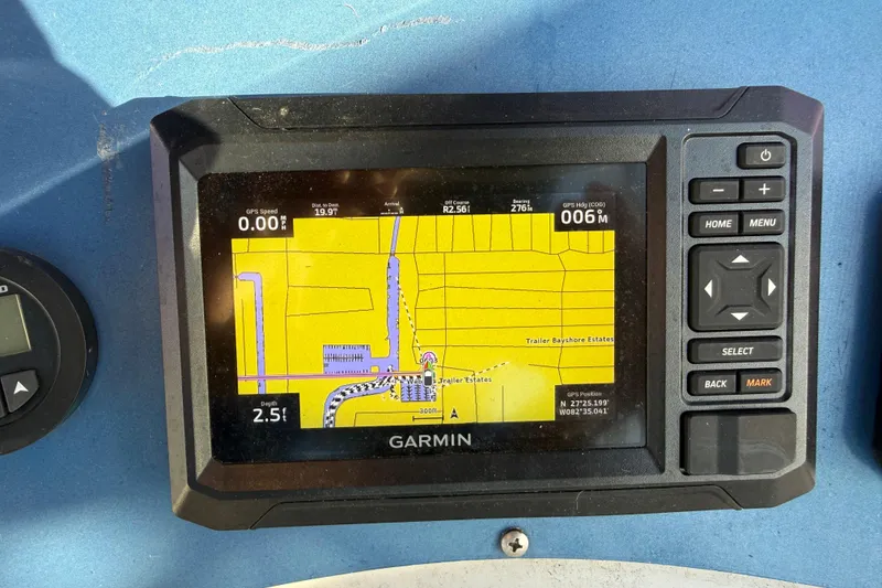 Slide: The Image of Garmin GPS display on 2021 Aloha Pontoon Tropical Series 23, showing navigation map. - 13