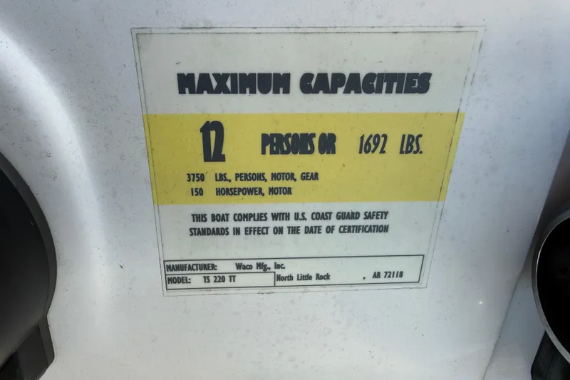Slide: The Image of Capacity label for Aloha Pontoon Tropical Series 23, 2021, showing 12 persons or 1692 lbs limit. - 15