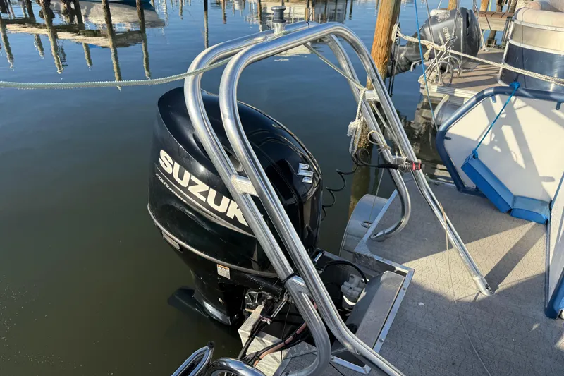 Slide: The Image of Aloha Pontoon Tropical Series 23 with Suzuki outboard motor, docked at marina, 2021 model. - 4