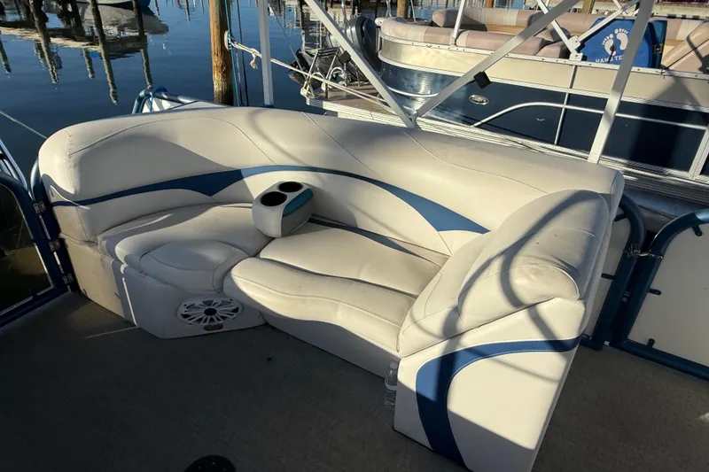 Slide: The Image of Luxurious seating on 2021 Aloha Pontoon Tropical Series 23 boat, featuring cup holders. - 8