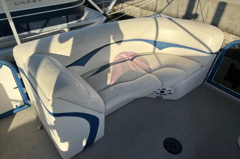 Slide: The Image of Aloha Pontoon Tropical Series 23, 2021 model, featuring white and blue cushioned seating. - 9