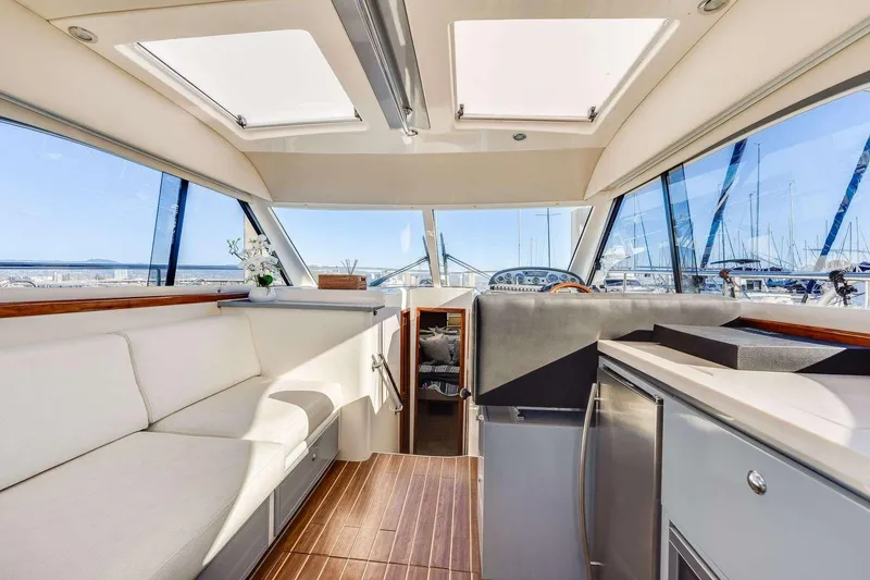 Slide: The Image of Luxurious 2007 Riviera yacht interior with modern seating and panoramic windows. - 12