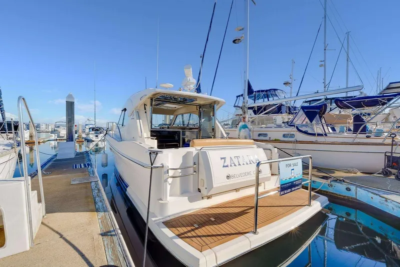 Slide: The Image of 2007 Riviera yacht docked, labeled "Zatara," with a "For Sale" sign. - 27