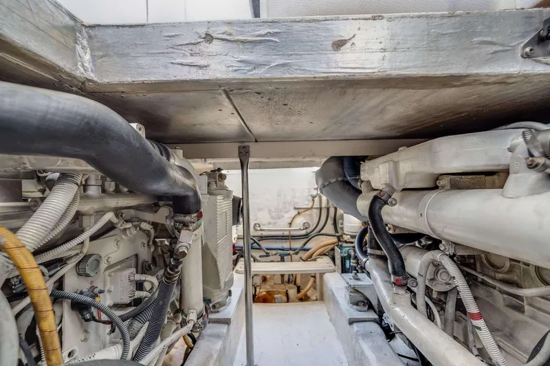 Slide: The Image of Engine room of a 2007 Riviera boat, showcasing mechanical components and piping. - 6