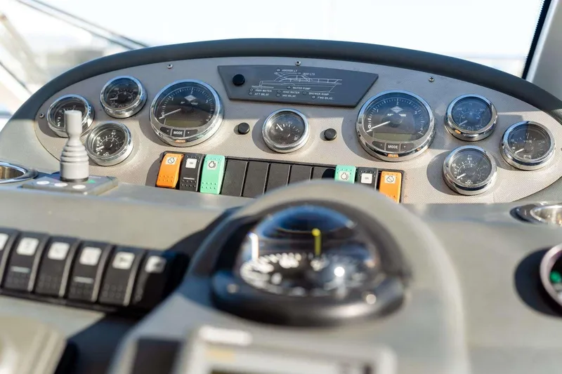 Slide: The Image of Control panel of a 2007 Riviera boat with gauges and switches. - 8
