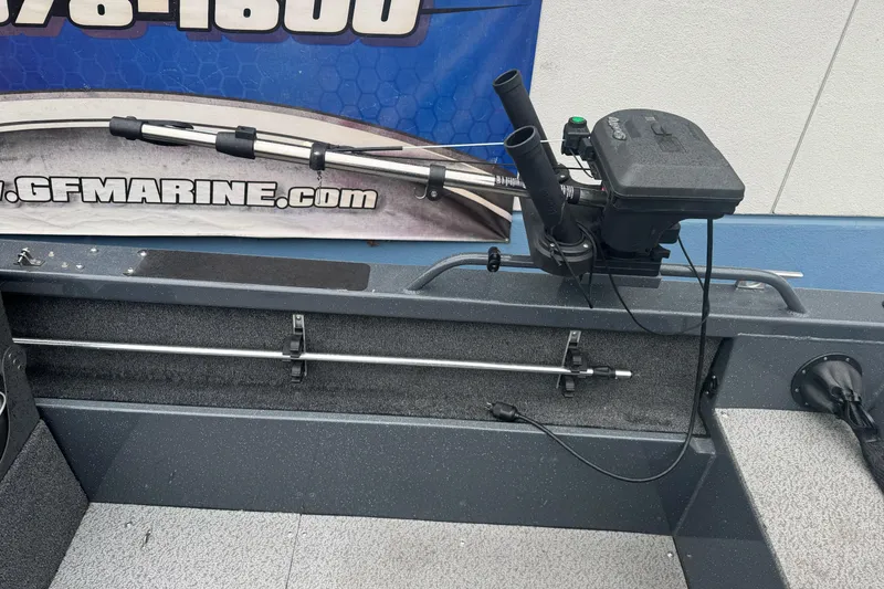 Slide: The Image of 2022 Duckworth 18 Advantage Sport boat interior with fishing rod holder and equipment. - 11