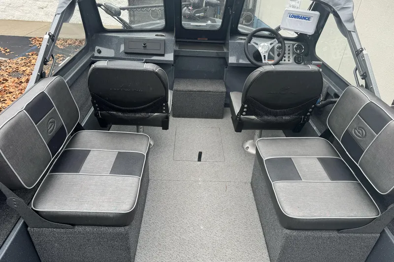 Slide: The Image of Interior of a 2022 Duckworth 18 Advantage Sport boat with seating and steering console. - 12