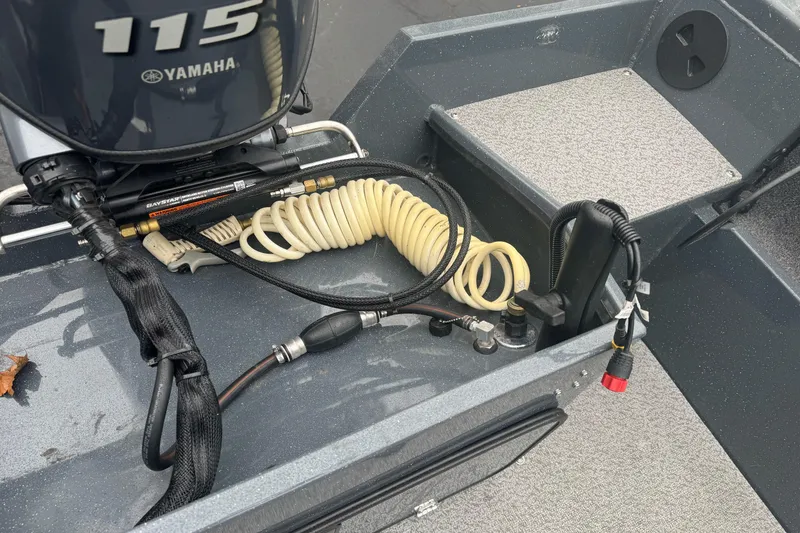 Slide: The Image of 2022 Duckworth 18 Advantage Sport boat with Yamaha 115 engine, coiled hose, and control panel. - 23