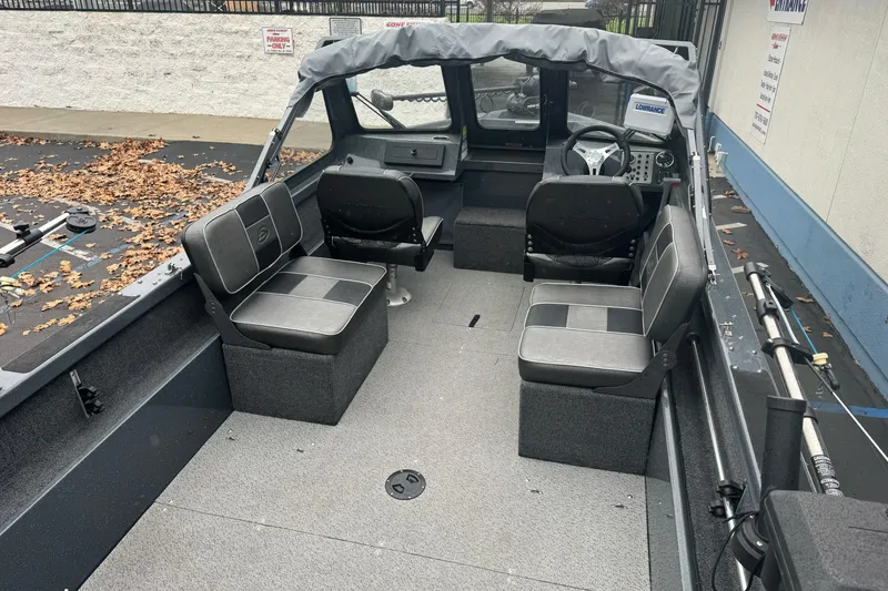 Slide: The Image of 2022 Duckworth 18 Advantage Sport boat interior with seating and steering console. - 9