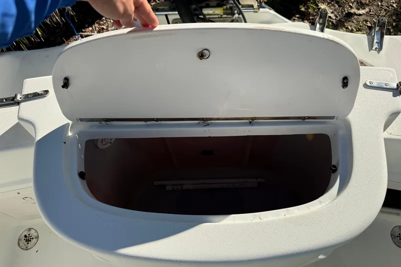 Slide: The Image of Open storage compartment on 2002 Fishmaster 212 Travis Edition boat. - 12
