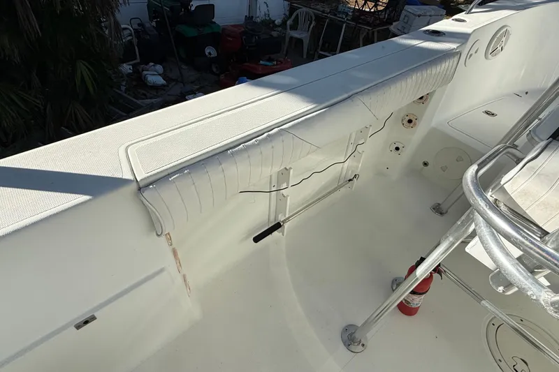 Slide: The Image of 2002 Fishmaster 212 Travis Edition boat interior with seating and equipment. - 14