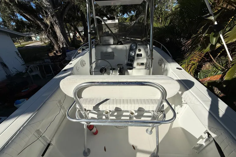 Slide: The Image of 2002 Fishmaster 212 Travis Edition boat interior with steering console and seating. - 16