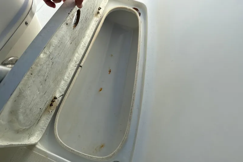 Slide: The Image of Open storage compartment on 2002 Fishmaster 212 Travis Edition boat. - 28