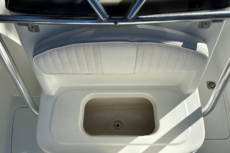 Slide: The Image of Fishmaster 212 Travis Edition 2002 boat seat with storage compartment. - 31