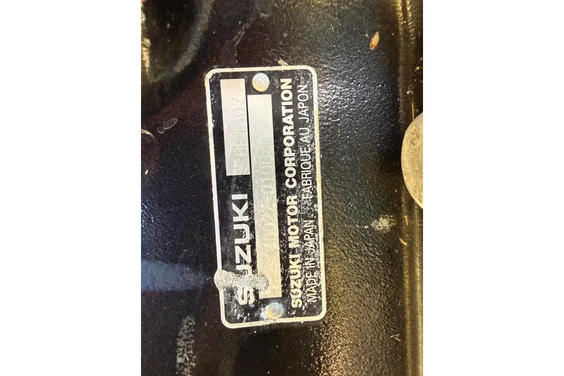 Slide: The Image of Suzuki Motor Corporation label on Fishmaster 212 Travis Edition, 2002 model. - 35