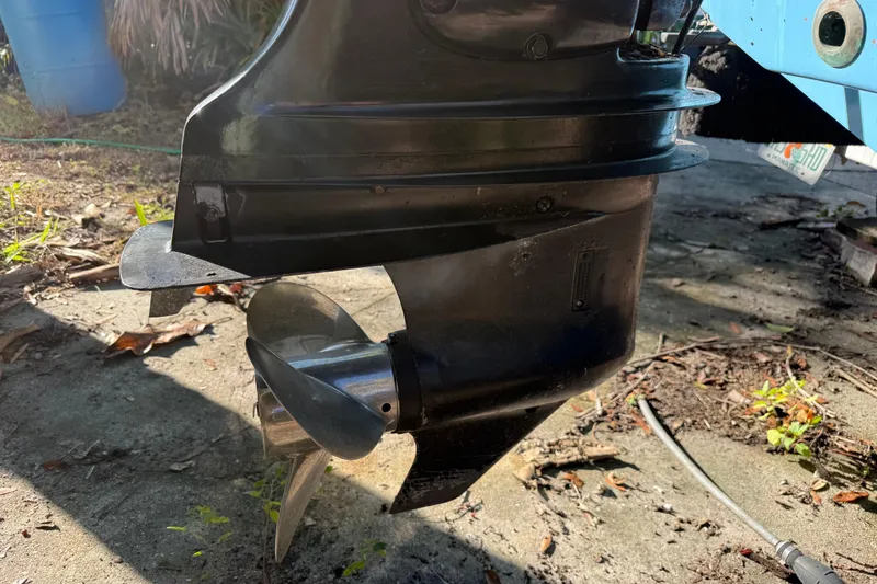 Slide: The Image of Close-up of a 2002 Fishmaster 212 Travis Edition boat propeller in sunlight. - 6