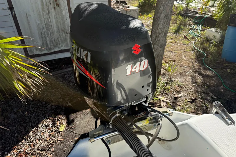 Slide: The Image of Suzuki 140 outboard motor on 2002 Fishmaster 212 Travis Edition boat. - 8