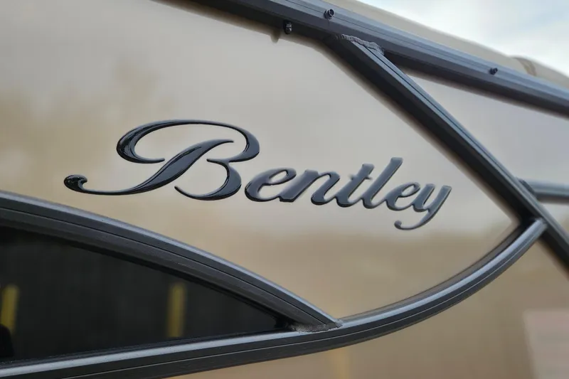Slide: The Image of 2026 Bentley Pontoons Legacy 243 Cruise logo on boat exterior. - 5