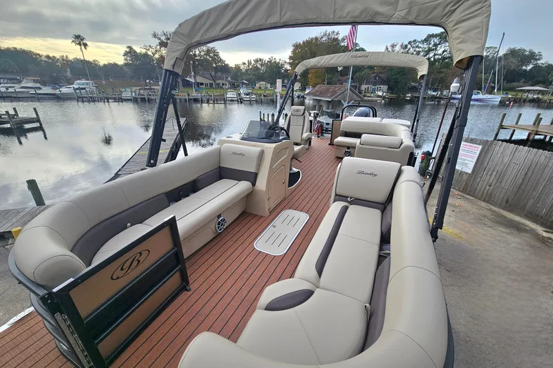 Slide: The Image of 2026 Bentley Pontoons Legacy 243 Cruise on a serene waterfront dock. - 9
