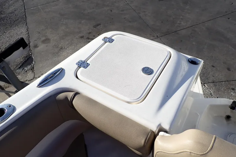 Slide: The Image of 2015 Pioneer 222 Venture boat interior with storage compartment and seating. - 20