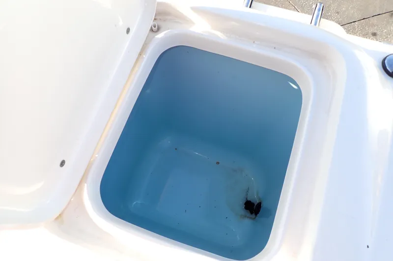 Slide: The Image of Open storage compartment in 2015 Pioneer 222 Venture boat. - 21