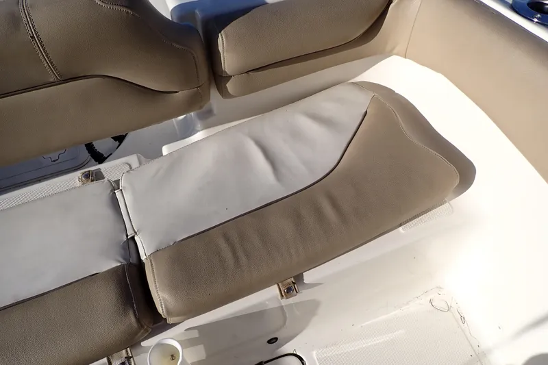 Slide: The Image of 2015 Pioneer 222 Venture boat seat with beige upholstery and white accents. - 28
