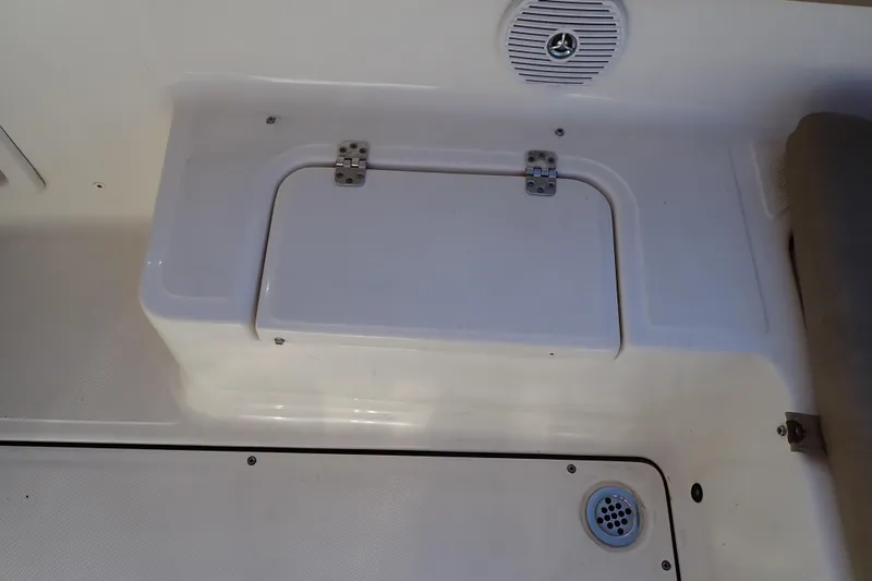 Slide: The Image of 2015 Pioneer 222 Venture boat interior with storage compartment and speaker. - 30