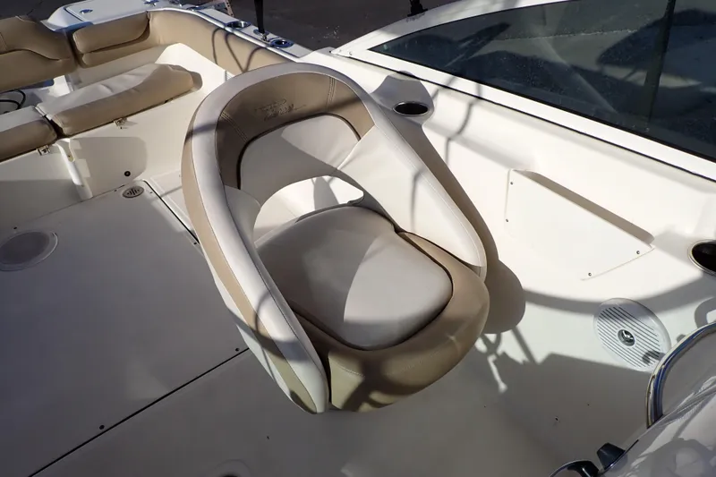 Slide: The Image of 2015 Pioneer 222 Venture boat interior with beige seating and white deck. - 32