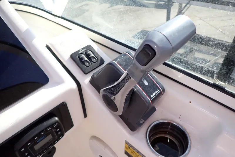 Slide: The Image of Control panel of 2015 Pioneer 222 Venture boat with Suzuki throttle. - 35