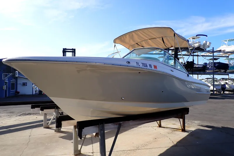 Slide: The Image of 2015 Pioneer 222 Venture boat on display with canopy, docked in marina. - 4