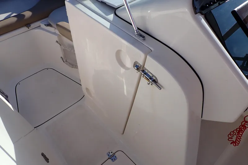 Slide: The Image of Interior view of 2015 Pioneer 222 Venture boat, featuring seating and storage area. - 42