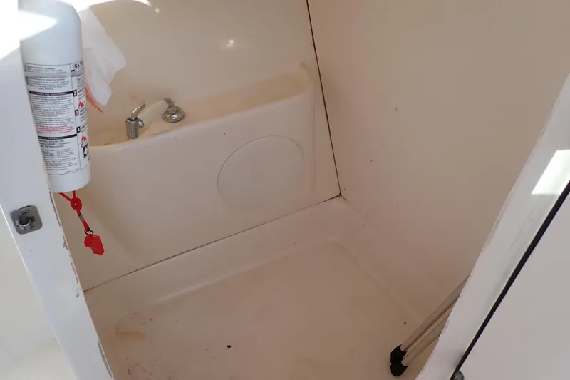 Slide: The Image of Interior of 2015 Pioneer 222 Venture boat with fire extinguisher and faucet. - 45