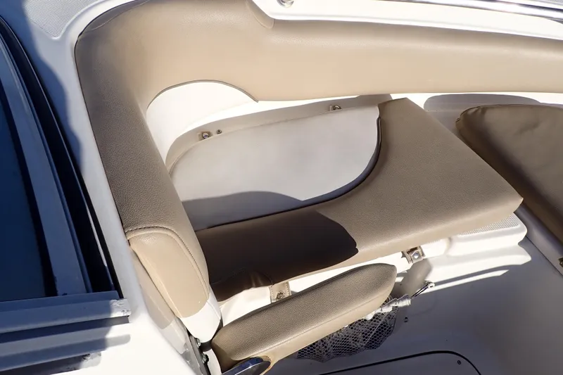 Slide: The Image of 2015 Pioneer 222 Venture boat interior seating with beige cushions. - 46