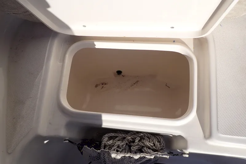 Slide: The Image of Open storage compartment on 2015 Pioneer 222 Venture boat with rope inside. - 47