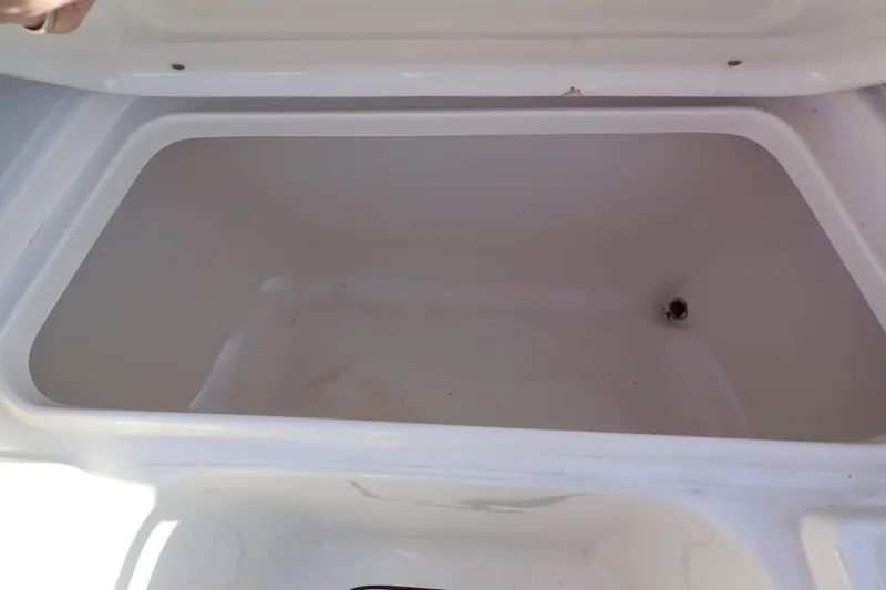 Slide: The Image of Open storage compartment in 2015 Pioneer 222 Venture boat. - 49