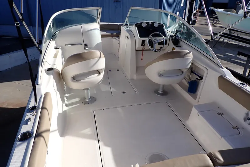 Slide: The Image of 2015 Pioneer 222 Venture boat interior with seating and steering console. - 5