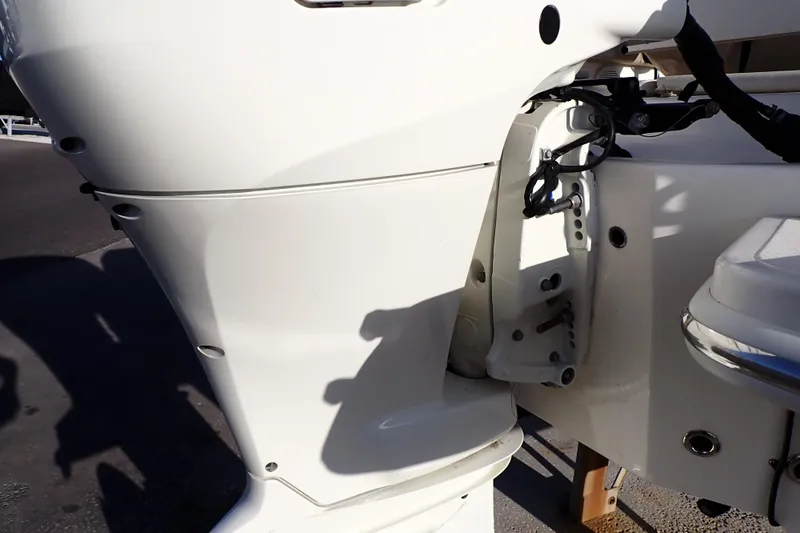 Slide: The Image of 2015 Pioneer 222 Venture boat engine close-up, showcasing white exterior and mechanical details. - 54