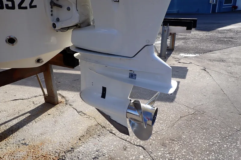 Slide: The Image of Close-up of a 2015 Pioneer 222 Venture boat's outboard motor and propeller. - 61