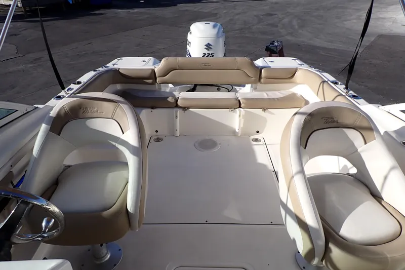 Slide: The Image of Interior of 2015 Pioneer 222 Venture boat with beige seating and Suzuki 225 engine. - 7