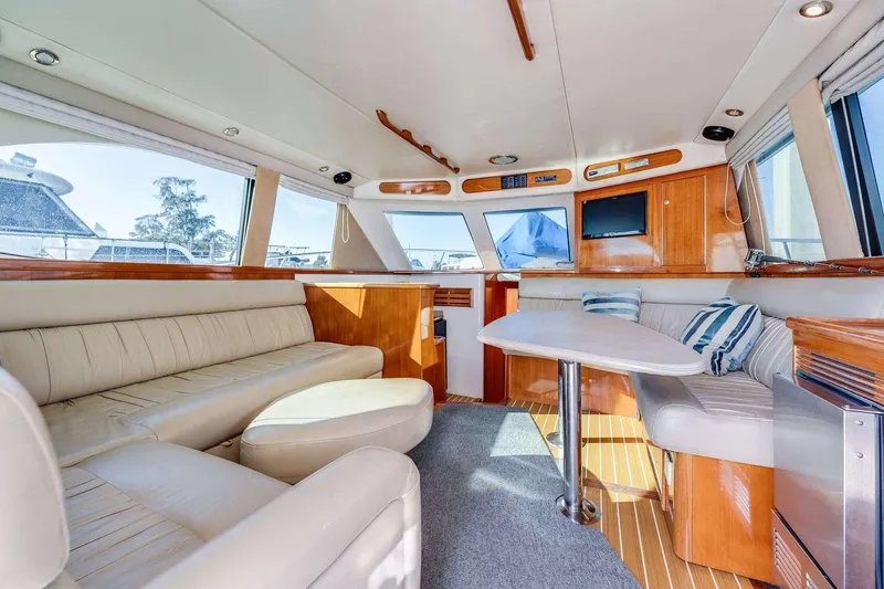Slide: The Image of Luxurious interior of a 2004 Riviera Convertible yacht with plush seating and modern amenities. - 2