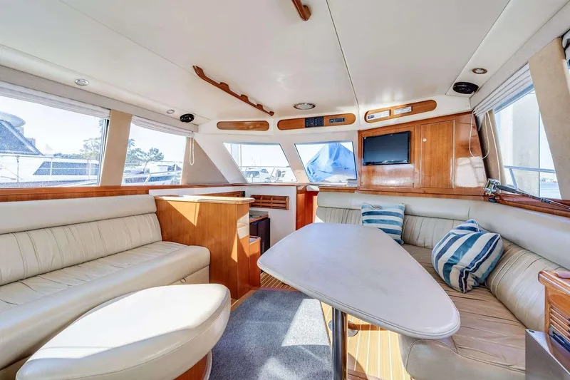 Slide: The Image of Luxurious interior of 2004 Riviera Convertible yacht with plush seating and modern amenities. - 20