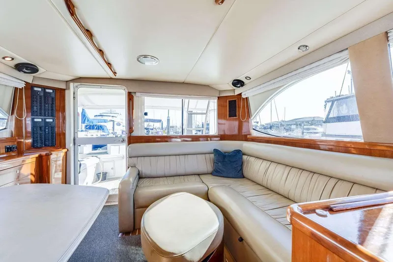 Slide: The Image of Luxurious interior of a 2004 Riviera Convertible yacht with leather seating and panoramic windows. - 3